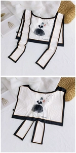 Detail of silk scarf featuring polka dots and hand-drawn fashion figure illustration
