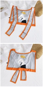 Detail of silk-like ice silk shawl featuring retro cartoon character print and orange border