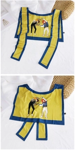 Close-up of a yellow cartoon print ice silk sun protection shawl with a blue border