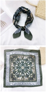 Detail of dark green cotton linen square scarf with vintage animal print and knot styling