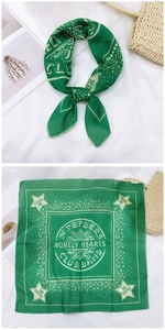 Detail of green cotton linen square scarf with vintage star and circle print decoration