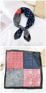 Detail of cotton linen neckerchief with red and navy paisley patterns and flat stitching