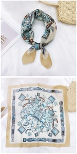 Detailed view of square cotton linen scarf with vintage floral prints and beige edges