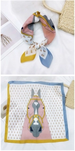 Macro detail of cotton linen square scarf showing equestrian horse print and geometric edges