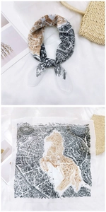 Detailed flat lay of cotton linen square scarf with vintage map and horse silhouette