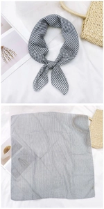 Close-up of black and white checkered cotton linen small square scarf with hemmed edges