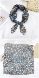 Close-up of floral cotton linen square scarf in grey blue with elegant knotted display