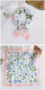 Detailed close-up of floral and beetle print cotton linen scarf with pink edges
