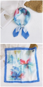 Detailed flat lay of abstract floral cotton linen scarf with blue artistic watercolor pattern