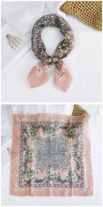 Close-up of peach floral cotton linen scarf showing delicate patterns and soft texture