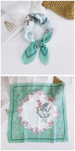 Detailed view of floral print cotton linen neck scarf with light green borders