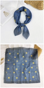 Detail of navy blue cotton linen square scarf with yellow star and moon pattern