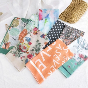 Collection of patterned cotton linen scarves featuring tropical and floral prints