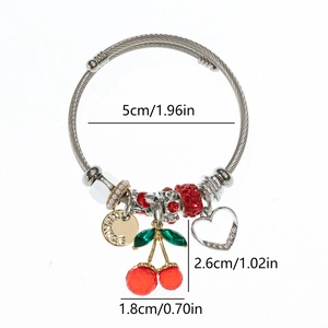 Stainless steel charm bracelet with red cherry pendants and heart charms on white background
