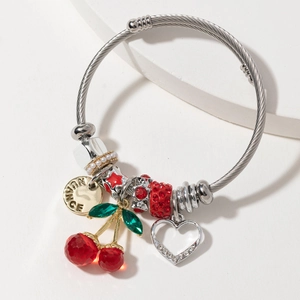 Stainless steel bangle featuring red crystal cherries and heart charm pendants