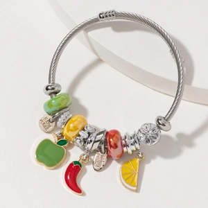Silver twisted bangle with colorful fruit charms and handmade metal tags on white stand