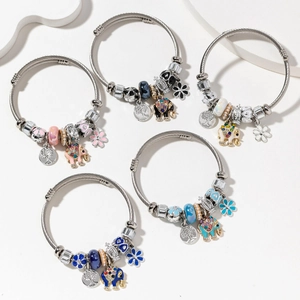 Five styles of bohemian steel mesh bangles featuring elephant and tree of life charms
