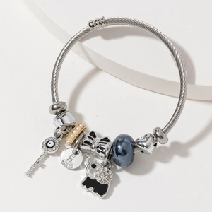 Silver stainless steel cable bracelet with evil eye key and crystal ghost charms