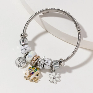 Silver woven beaded bracelet with colorful elephant, flower charms and tree of life pendant