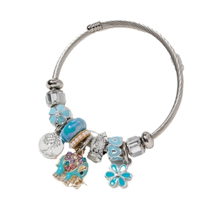 Silver charm bracelet with blue floral beads, elephant pendant and tree of life charm