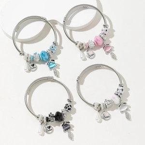 Four sets of beaded steel wire bracelets with fox charms and colorful crystal accents