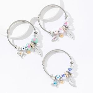 Adjustable stainless steel bangles with elephant, evil eye, and pearl charms for women