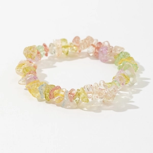 Detail of colorful irregular natural crystal chips on a minimalist elastic bracelet
