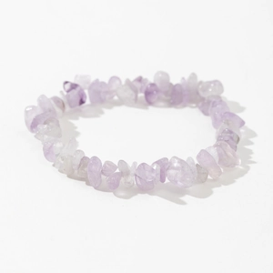Detailed shot of handmade elastic bracelet with natural purple amethyst crystal chips