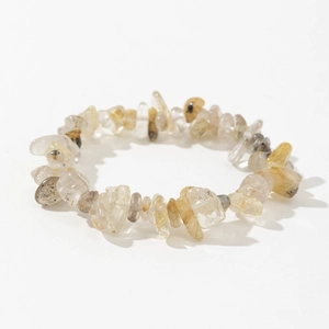 Detailed top view of natural golden rutilated and smoky quartz irregular stone bracelet