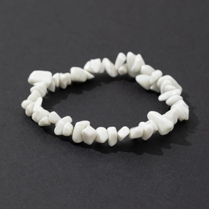 Detailed view of handmade stretch bracelet with irregular natural white stone chips