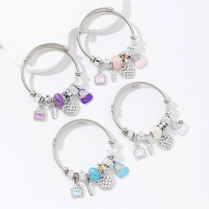 Macro shot of 4-piece stainless steel charm bracelets with hearts and enamel bag pendants