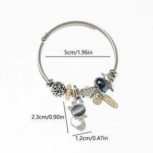 Detailed view of stainless steel beaded bracelet with cat pendant and size markings