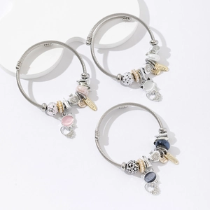 Three-piece stainless steel open bangle set with cat charms and heart pendants