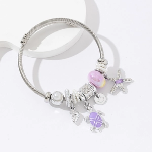 Adjustable silver wire ocean charm bracelet with starfish, turtle and sea shell charms