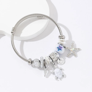 Adjustable stainless steel ocean charm bracelet with starfish and turtle pendants