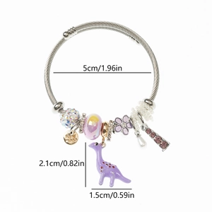 Detail of beaded dinosaur bracelet with purple charms and handmade tag showing size dimensions