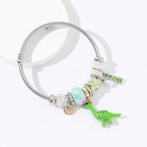 Silver woven rope bracelet featuring a green dinosaur charm and colorful crystal beads