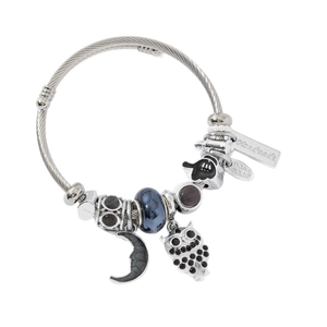 Silver owl moon charm bracelet with blue beads and handcrafted metal tags on white background