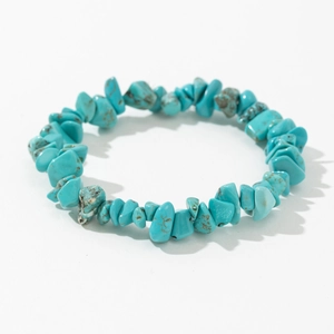 Elastic bracelet made of irregular turquoise stones with natural brown and black mineral veins