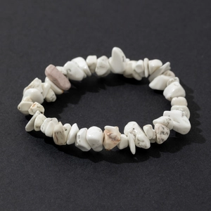 Elastic bracelet with irregular natural white turquoise stone chips on black background