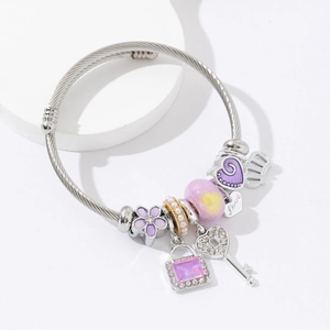 Silver charm bracelet with purple enamel flowers, heart key pendants and crown charms