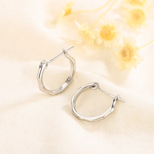 Minimalist S925 sterling silver hoop earrings with irregular liquid wave texture