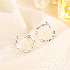 Minimalist S925 sterling silver hoop earrings with liquid wave texture for women