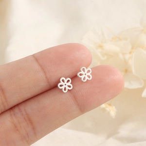 Minimalist S925 silver flower stud earrings for women with six-petal hollow design
