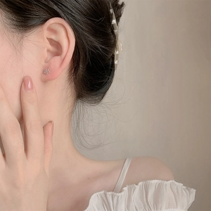 Minimalist S925 sterling silver hollow flower stud earrings for elegant daily wear