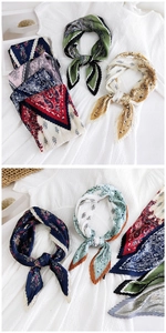 Detailed view of micro-pleated square scarves featuring paisley and floral patterns