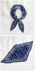 Detailed close-up of navy blue paisley pleated scarf featuring fine organza pleats