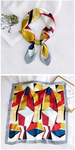 Detail of geometric pattern satin silk square scarf with colorful patchwork design