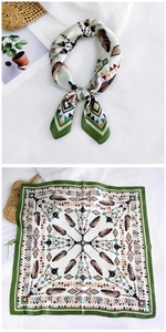 Detail of 70cm square silk scarf featuring bohemian feather patterns and green borders