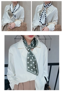 Detail of silk skinny scarf with heart and polka dot patterns for women's neck styling